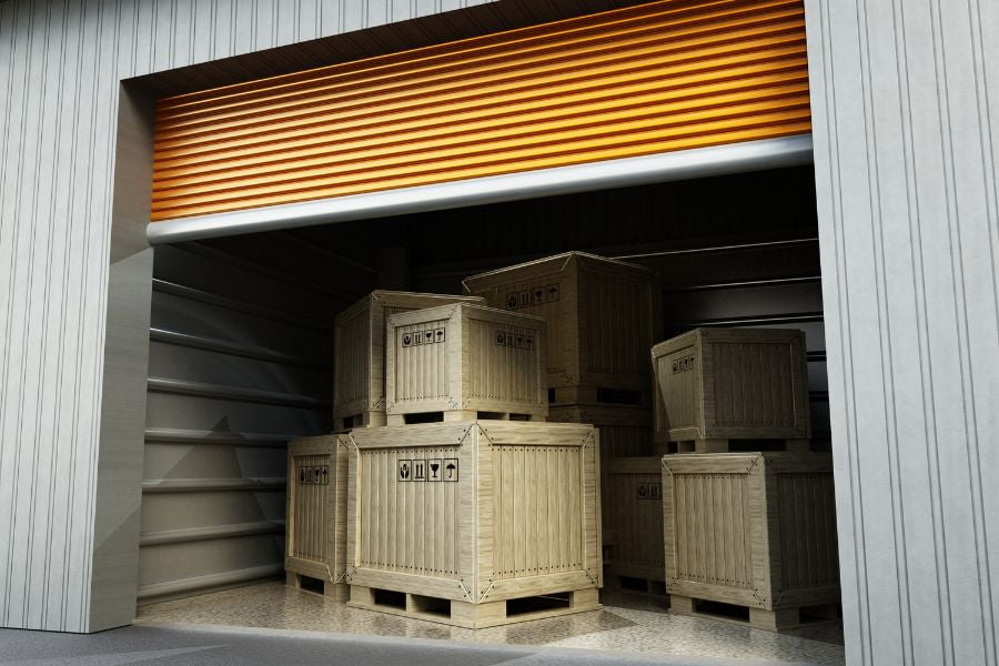 boxes stacked inside of a storage unit