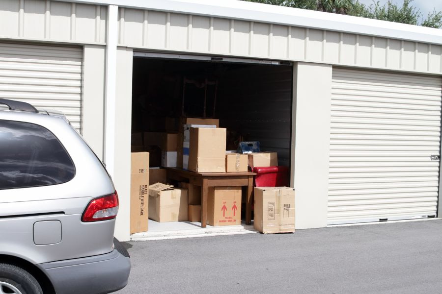 assorted items being placed into a storage unit